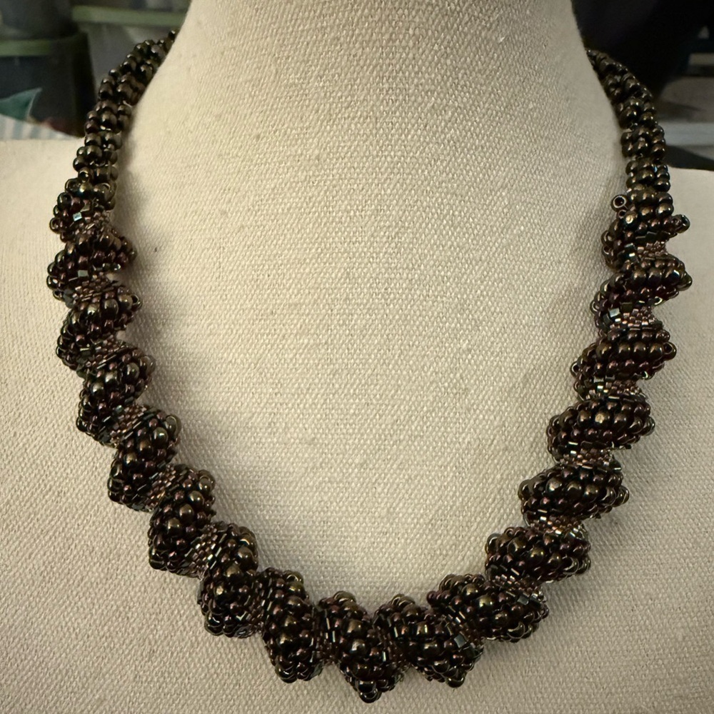 Twisted Graduated Multicolor Black Seed Bead Necklace w/Sterling Silver Clasp.